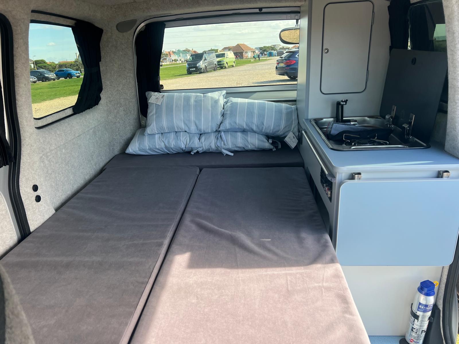 Nissan NV200 1.6 Petrol Automatic Camper  Elevating Roof, L shape Pull Out Bed on Runners with Porta Loo