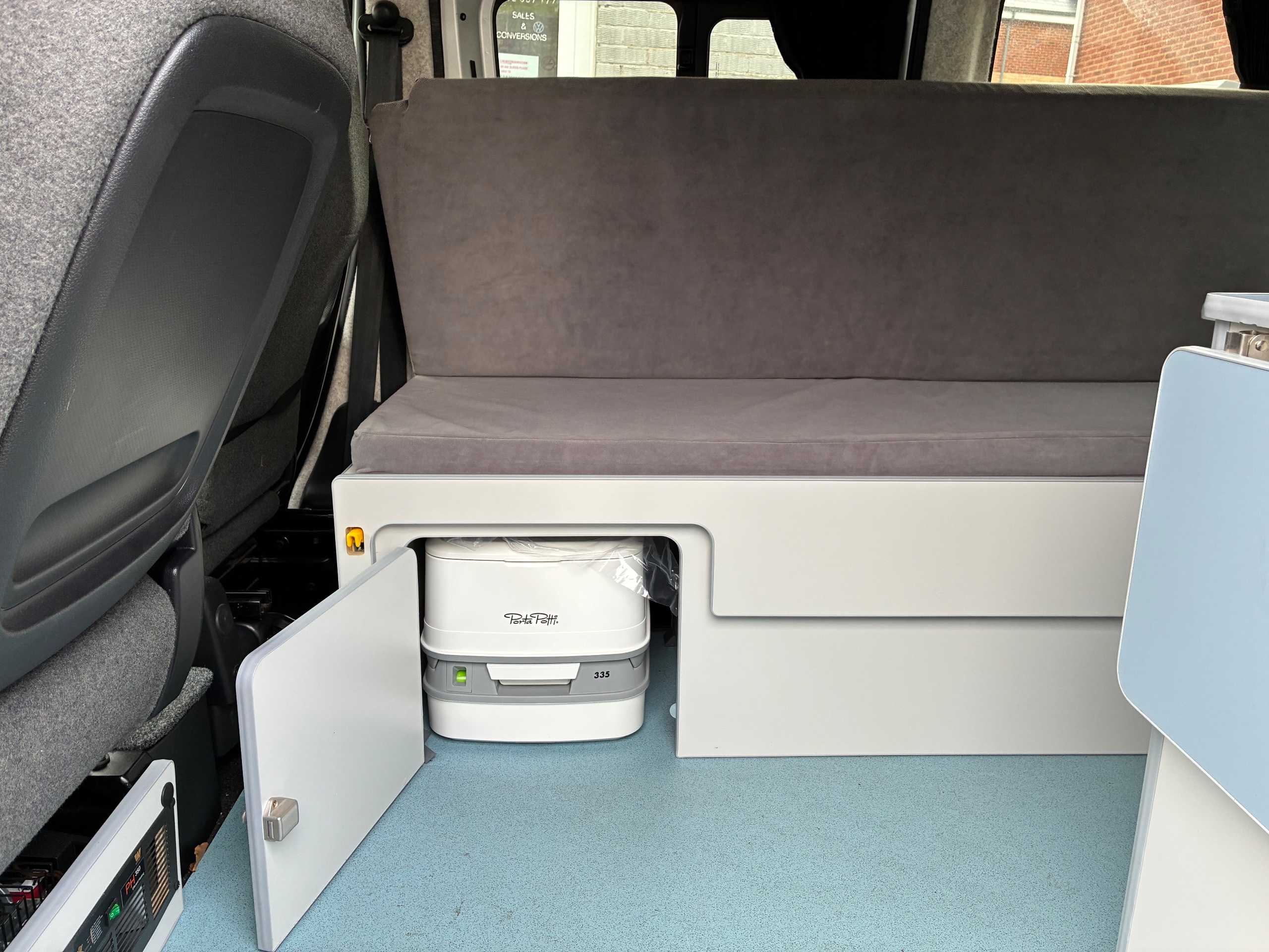 Nissan NV200 1.6 Petrol Automatic Camper  Elevating Roof, L shape Pull Out Bed on Runners with Porta Loo